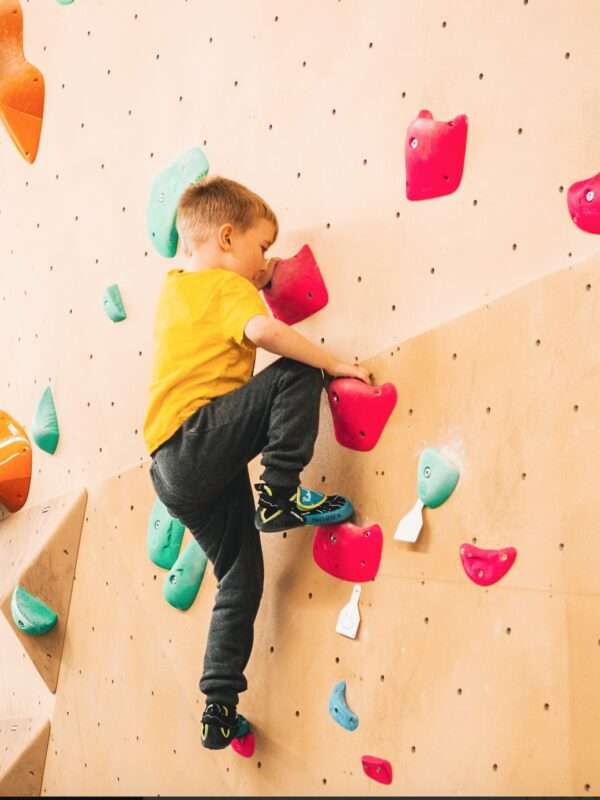 Boy climbing at Indirock