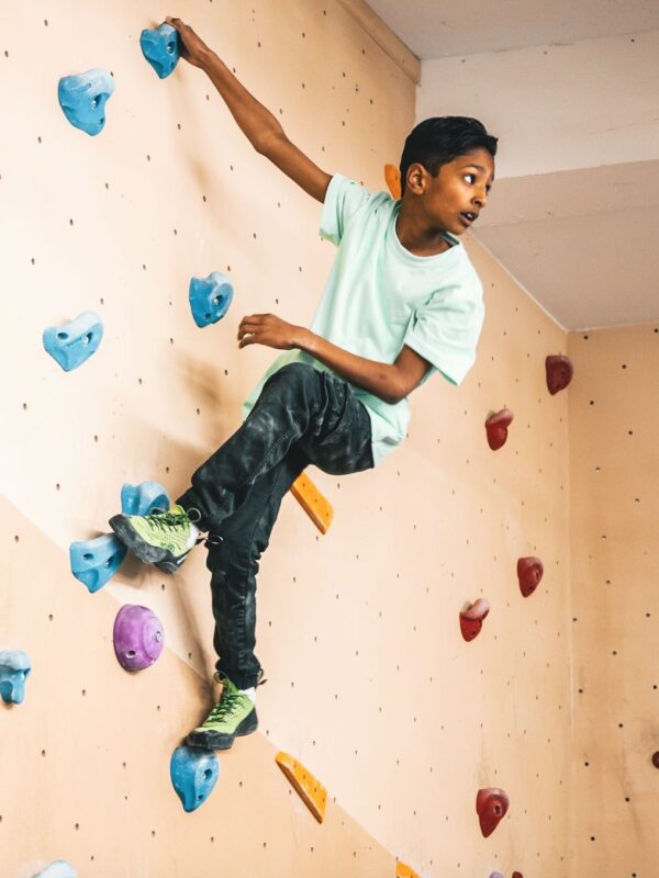 Teenage boy climbing at Indirock